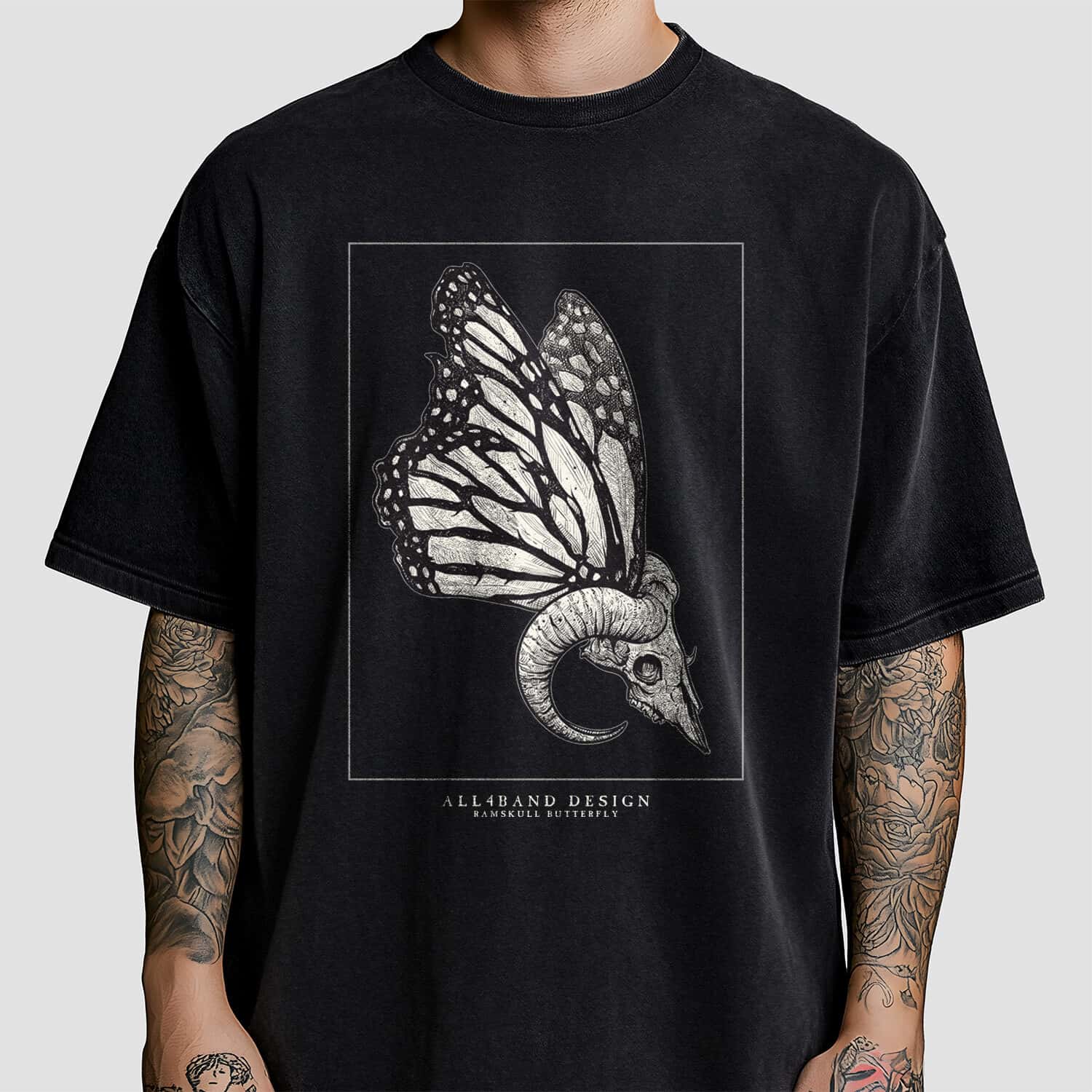 Metal band shirt design featuring a ram skull with butterfly wings