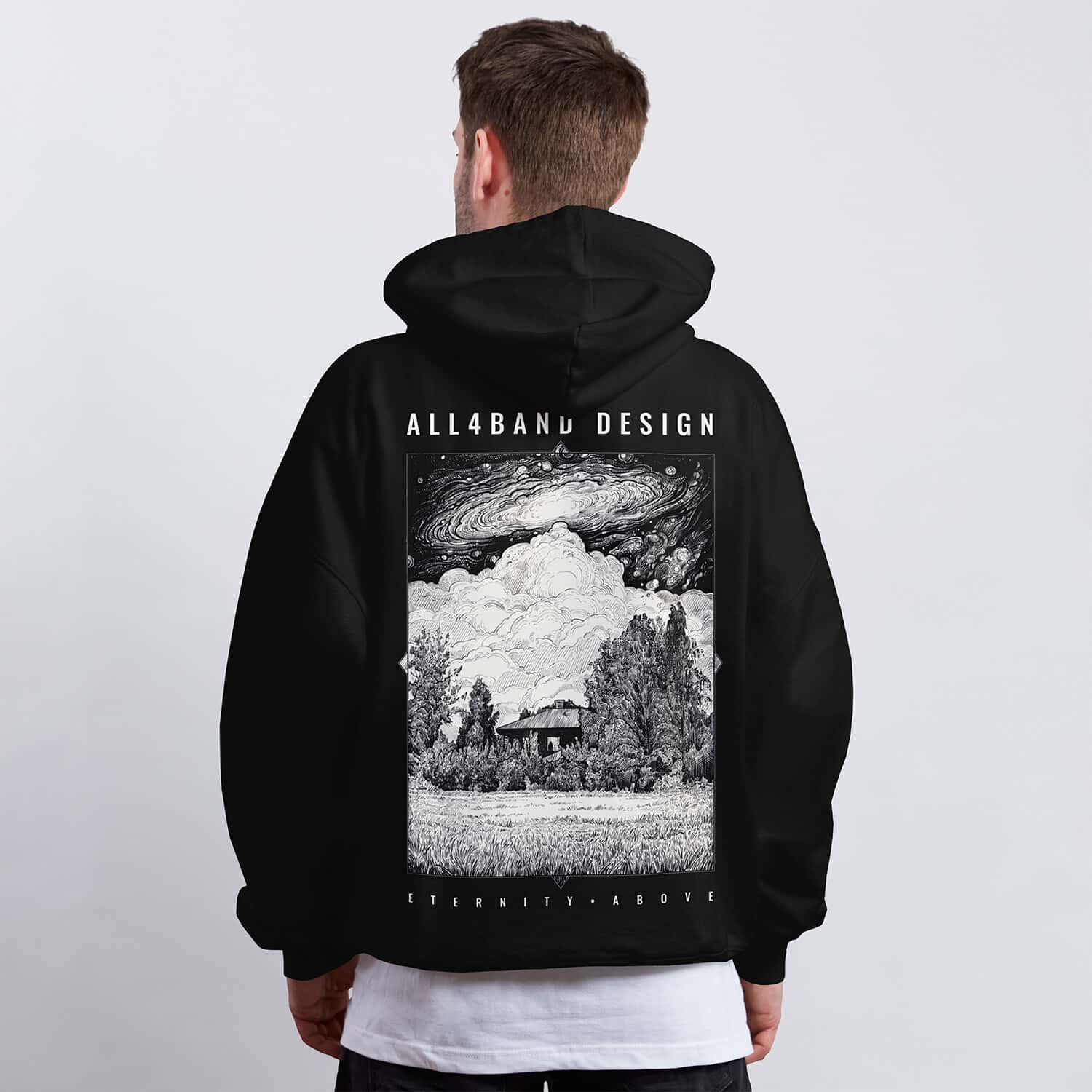 A band hoodie design featuring a cosmic storm over a solitary house in the woods