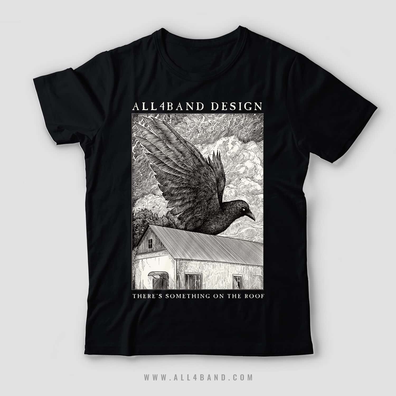Detailed black and white shirt design featuring a giant raven flying over a rural house beneath dense swirling clouds.