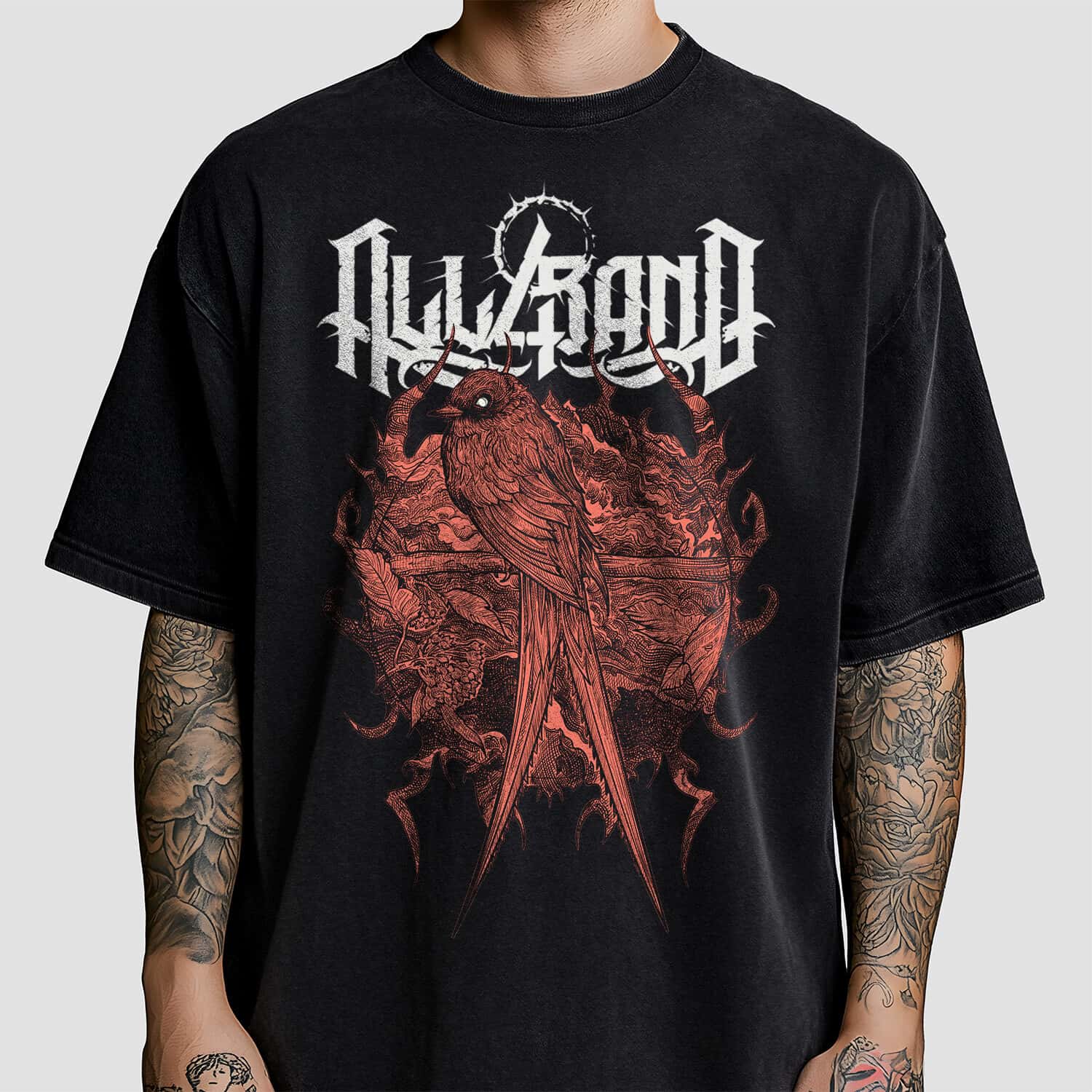 Detailed red ink shirt design of a long-tailed bird perched among twisted branches and organic ornamental forms.