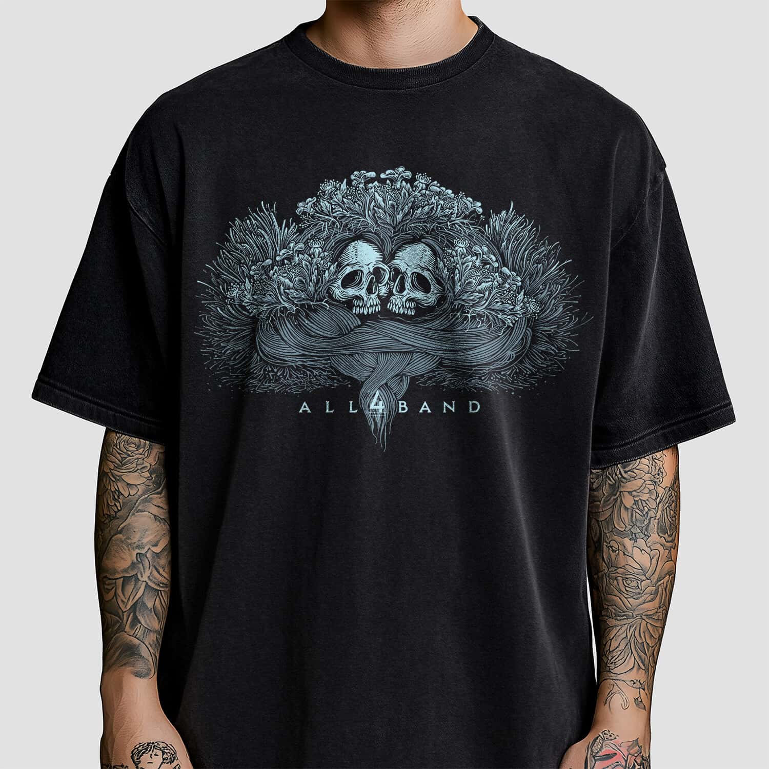 Metal band artwork featuring two skulls overgrown with wildflowers