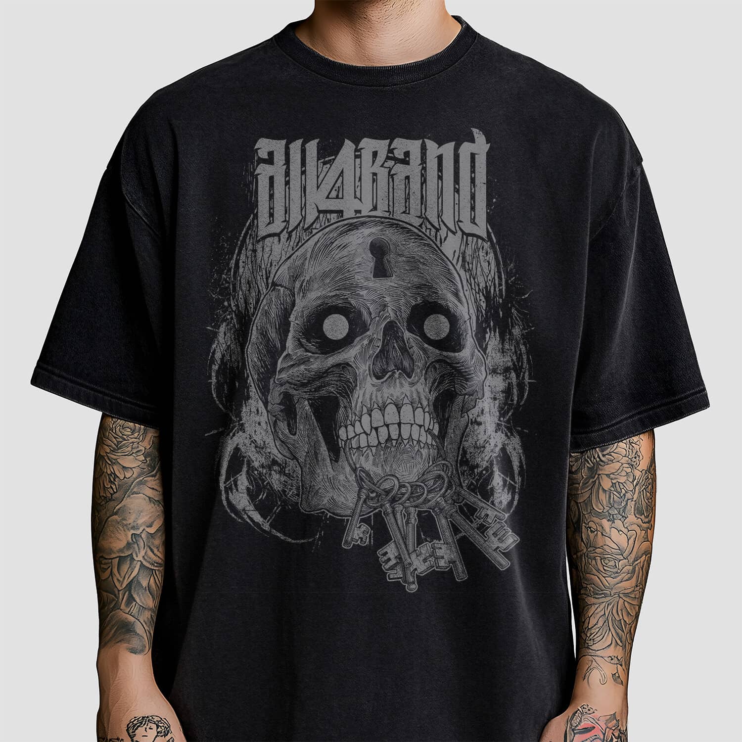 Band shirt design featuring a detailed skull with hollow eyes, a keyhole in its forehead and a bundle of antique keys in its mouth.