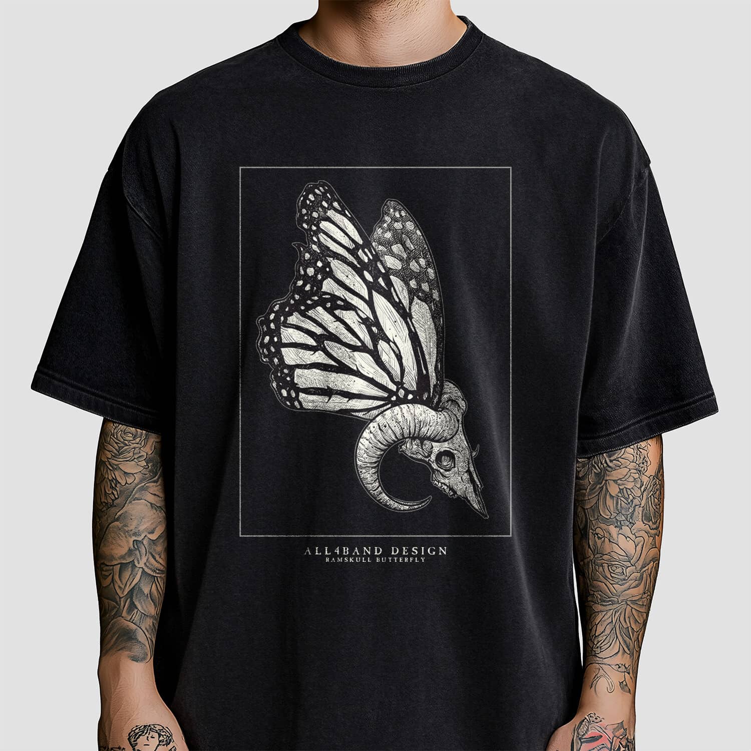 Metal band shirt design featuring a ram skull with butterfly wings