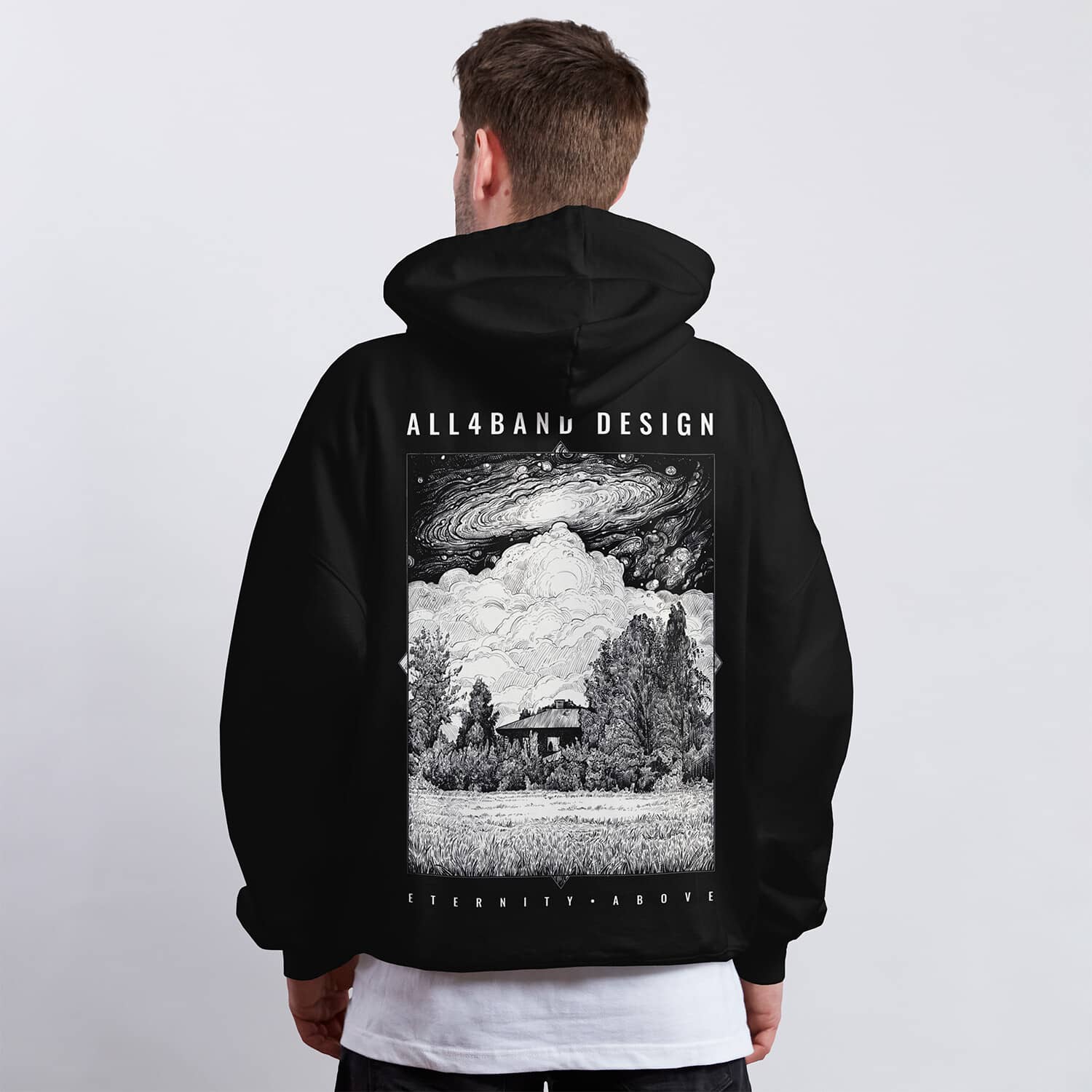 A band hoodie design featuring a cosmic storm over a solitary house in the woods