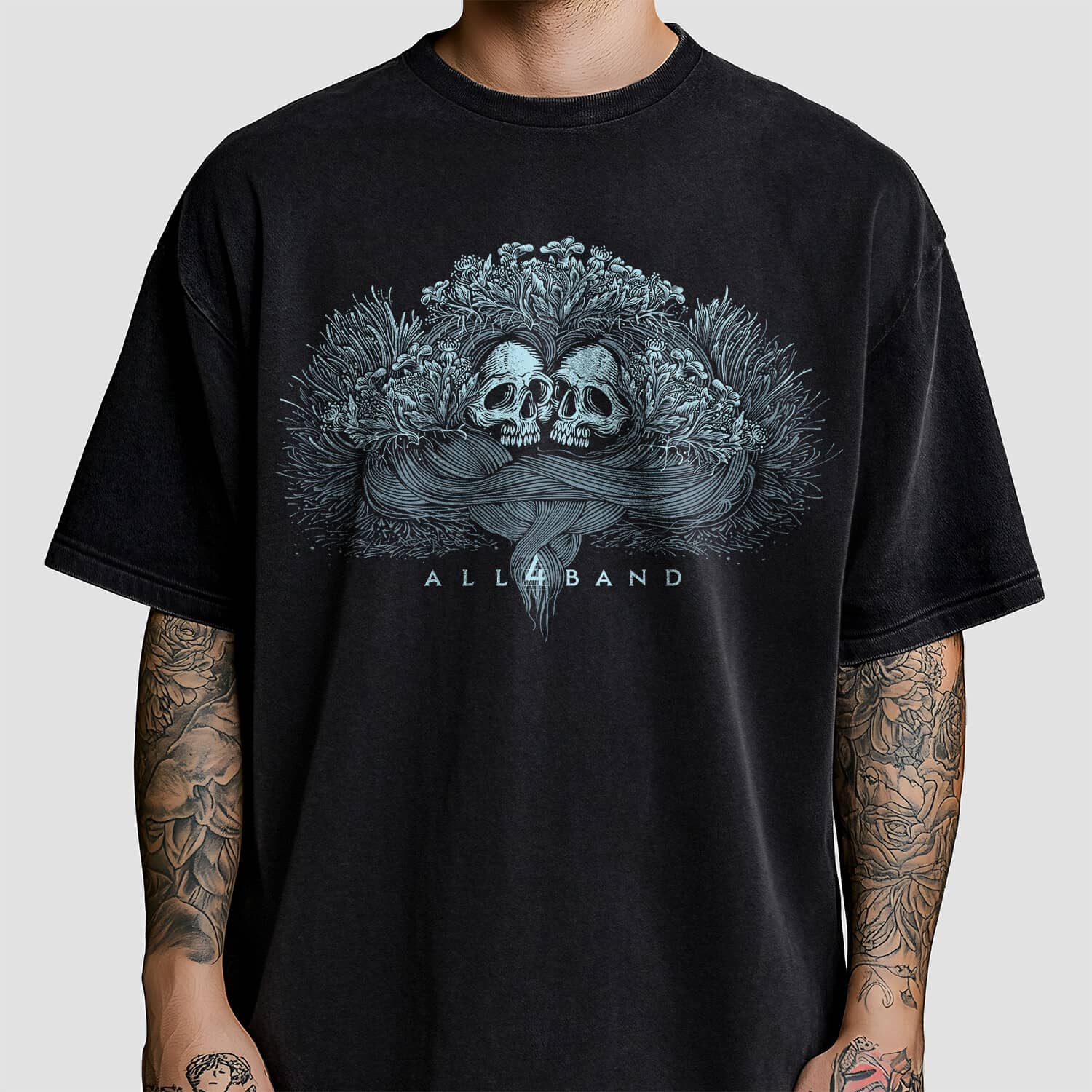 Metal band artwork featuring two skulls overgrown with wildflowers
